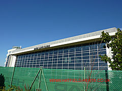 Side view of the hangar with the glass panelled wall inside the open Esavian doors