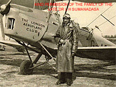 Dr Sumanadasa standing by a London Aeroplane Club Tiger Moth