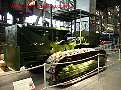Olive drab Caterpillar D-8 armoured bulldozer with pusher plate in the front