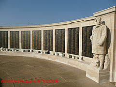 Metal panels bearing the names of the fallen and the statue of a sailor - section of the Royal Navy Memorial, Portsmouth