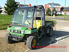 John Deere vehicle parked on the kerb on the old airfield