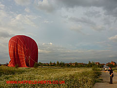 Another view of the balloon with the ground crew still keeping a grip of the cables