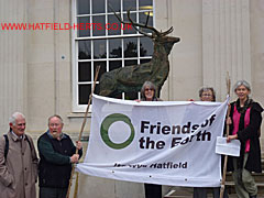 There till the end - Friends of the Earth with banner