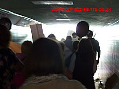 Marchers in the underpass tunnel leading to the town centre