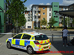 Police car and barrier line seen from in front of the Travelodge