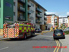 Fire engines around the back of the adjacent block