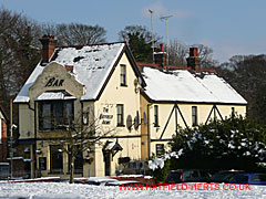 snow covered Hatfield Arms pub