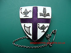 white and purple enamel silver Queenswood school badge
