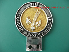London Aeroplane Club car badge - circular with a black outer and yellow background centre