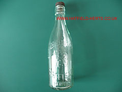 10-inch clear glass embossed bottle