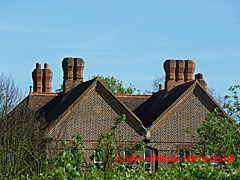 Several brick Tudor-style chimney stacks on Woodhall farmhouse