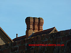 Close up of the triple brick stack on the right gable
