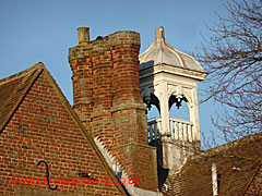 trio of brick stacks on top of Nast Hyde House