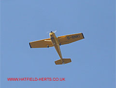 yellow, high wing monoplane Cessna 152