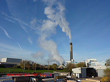 Plumes of emissions stream from the various stacks