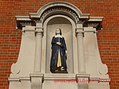Close up of figure above the doorway of the former Writing School building