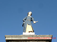 Close up of figure on gatepost