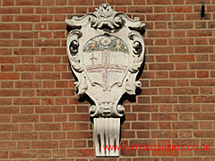 Crest mounted on brick wall