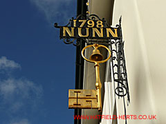 Ironmongers sign - 1798 Nunn with a golden key underneath - outside Hertford Museum