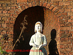 Close up of figure decorating the Girls' School exterior