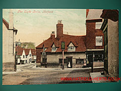 Colourised postcard view of the Eight Bells pub